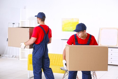 Professional team preparing an upright piano removal in Enfield