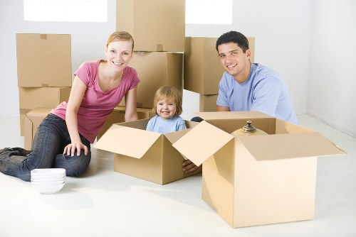 Professional movers handling furniture during an Enfield home move