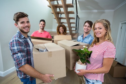 Professional flat removals in Enfield with boxes and moving van
