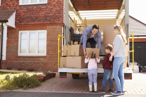 Removal crew pricing a house move in Enfield