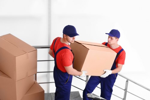 Man with van loading furniture for a move in Enfield