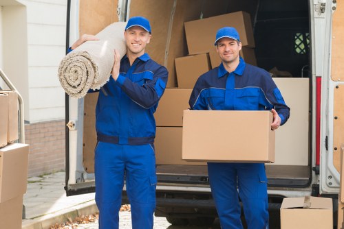 Removal team preparing boxes and furniture for a safe move