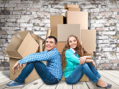 Professional movers handling furniture carefully in Enfield