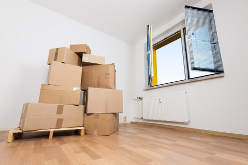 Removal team preparing a move in Enfield with organised boxes and furniture