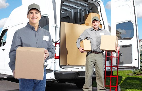 Local removals team handling boxes during an Enfield home move