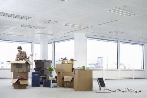 Professional removals team handling furniture during a house move in Enfield