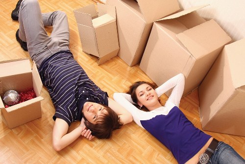 Removal team loading furniture and household items carefully