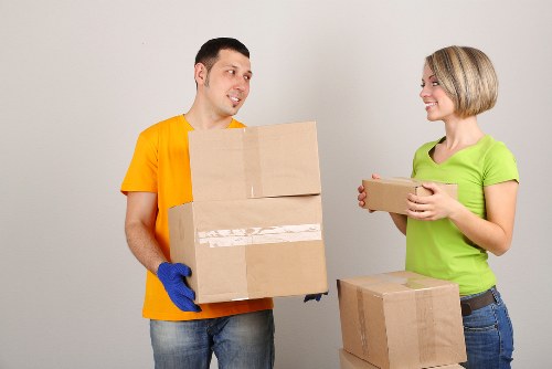 Loading student furniture and boxes into a removals van in Enfield