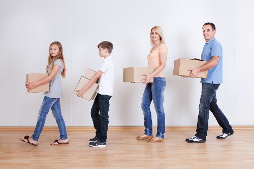 Packed office boxes and furniture ready for relocation